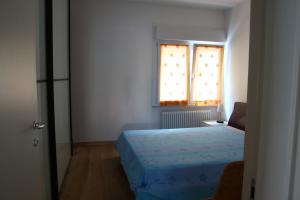 Ένα ή περισσότερα κρεβάτια σε δωμάτιο στο La Conchiglia