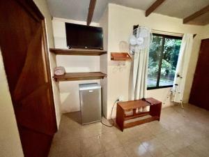 TV a/nebo společenská místnost v ubytování Zompopa Lodge