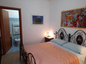 Postel nebo postele na pokoji v ubytování Bed&Breakfast L'Oasi