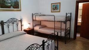 Postel nebo postele na pokoji v ubytování Bed&Breakfast L'Oasi