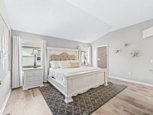 a bedroom with a white bed and a window at 3270 Z2A VILLAGE OF GLENBROOK by REMAX Premier in The Villages +15 photos