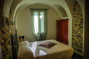 A bed or beds in a room at U Campanin