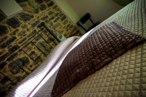 A bed or beds in a room at U Campanin