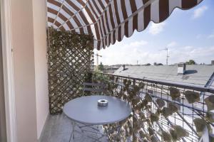 a table on the balcony of a building at Affittacamere Orchidea for Tourists Hesperia Hosp in Modena