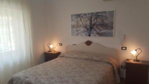 Postel nebo postele na pokoji v ubytování Bed&Breakfast L'Oasi