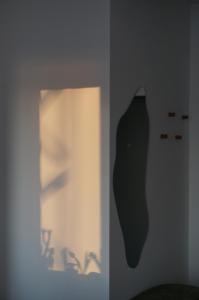 a black cat on a wall in a room at Urban Grove Apartment with Balcony and Free Parking in Floreşti