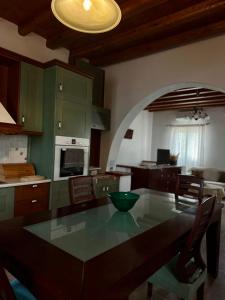 a kitchen with a table and a dining room at Home Sweet Home Milos in Triovasálos
