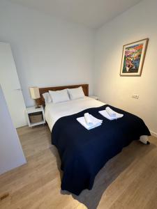 Postel nebo postele na pokoji v ubytování La Carabela, Elcano