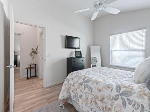 a bedroom with a bed and a ceiling fan at 5682 Z6 VILLAGE OF DESOTO by REMAX Premier in The Villages +13 photos