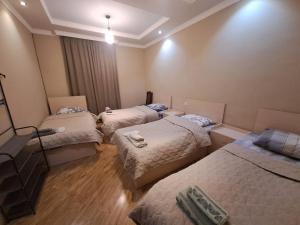 Llit o llits en una habitació de Guest House "AKHALTSIKHE"