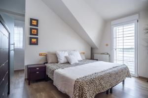 a bedroom with a bed and a large window at Holiday Villa Benmar in Castellón de la Plana +14 photos