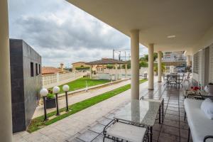 a balcony with a view of a yard at Holiday Villa Benmar in Castellón de la Plana