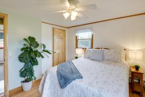 a bedroom with a bed and a ceiling fan at Day Trip to Acadia Quiet Coastal Maine Escape in Harrington