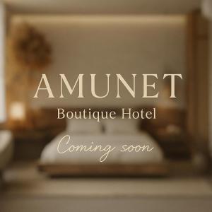 a sign that reads ament boutique hotel coming soon at AMUNET Pyramids View Boutique Hotel in Cairo