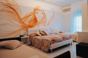 Postel nebo postele na pokoji v ubytování Hotel Julia