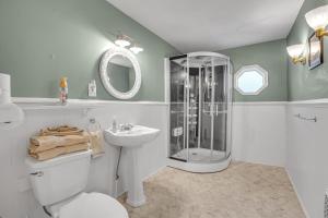 a bathroom with a shower and a toilet and a sink at Doyle House - Near Cooperstown Dreams Park 2 in Milford +34 photos