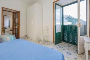 Ένα ή περισσότερα κρεβάτια σε δωμάτιο στο Marina Grande Harbor