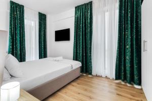 Ένα ή περισσότερα κρεβάτια σε δωμάτιο στο Solea Apartament