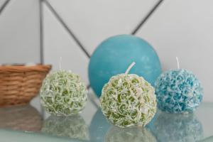 a glass shelf with three balled up balls on it at Terrazza fronte Mare in Castro di Lecce +11 photos