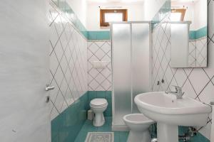 a bathroom with a toilet and a sink at Terrazza fronte Mare in Castro di Lecce