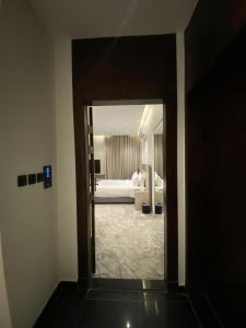 Postel nebo postele na pokoji v ubytování استديو جود الفندقي