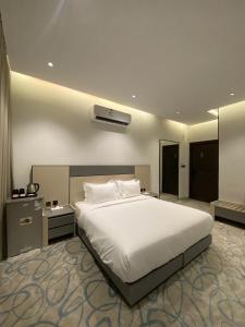 Postel nebo postele na pokoji v ubytování استديو جود الفندقي