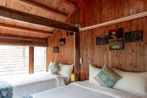 Postel nebo postele na pokoji v ubytování Legend Home Sapa