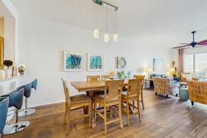 a dining room with a table and chairs at Harborview Grande 402 in Clearwater Beach