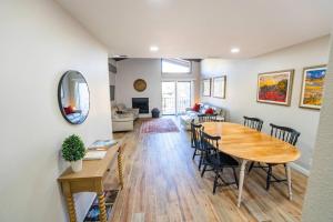 a dining room and living room with a table and chairs at Marcs Red Rock Retreat 2 Primary Suites 2 Bath in Sedona