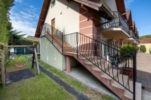 a house with stairs on the side of it at Skorpion in Rewal +7 photos