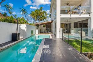 a swimming pool in the backyard of a house at Pool Table and Resort Pool 4BR Holiday Paradise in Algester