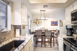 a kitchen and dining room with a table and chairs at DreamWest Sedona Getaway - 3 Bdrm 2 Ba - Sleeps 6 in Sedona