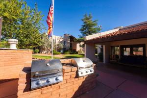 a brick wall with a grill and a flag at Johnnys Sedona Getaway 2 Primary Suites 2 Bath in Sedona