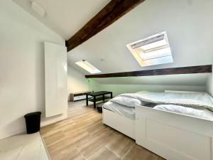 En eller flere senge i et værelse på Le Graoully