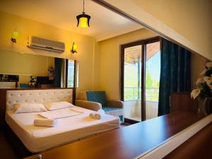 Postel nebo postele na pokoji v ubytování Adrasan Yazıcı Hotel