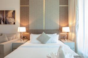 Ένα ή περισσότερα κρεβάτια σε δωμάτιο στο SIMPLY COMFORT in J ONE Tower