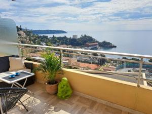 a balcony with a view of the water at MONACO - FANTASTIC Apartment and Sea View -1 bedroom 80m2 in Roquebrune-Cap-Martin +14 photos