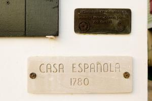 a sign that reads casa escondida on a wall at Suite C Beach, Firepit, Dog-friendly, Downtown! in Biloxi