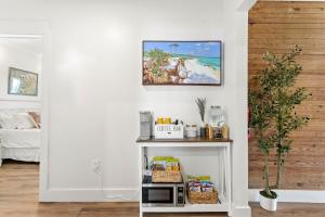 a room with a white shelf with food on it at Suite C Beach, Firepit, Dog-friendly, Downtown! in Biloxi