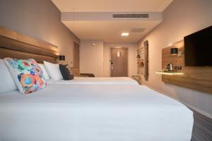Voodi või voodid majutusasutuse Moxy Dublin City toas