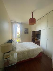 a bedroom with a bed and a desk and a window at ROOM in Molhe house with pool in Porto +12 photos