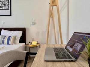 A television and/or entertainment centre at El Greco Apartments in Tigaki, near the sea - No 3