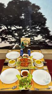 a table with plates of food on top of it at Marina Hotel in Sohar +37 photos