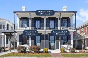 a building with street signs in front of it at Suite C Beach, Firepit, Dog-friendly, Downtown! in Biloxi