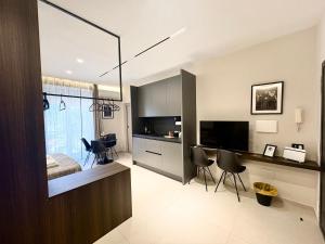 a room with a kitchen and a living room at Stay in Naples in Naples