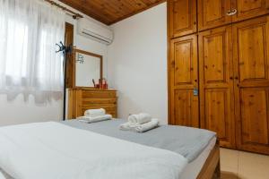 Postel nebo postele na pokoji v ubytování Villa Chrysa Panorama + 19 fotografií