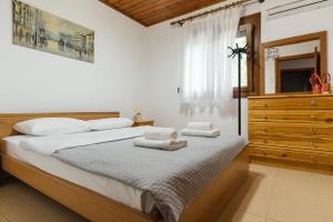 Postel nebo postele na pokoji v ubytování Villa Chrysa Panorama