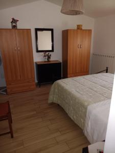 A bed or beds in a room at Alloggio Turistico Civico 4