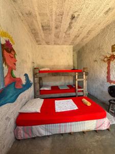 Giường trong phòng chung tại Hostel Flor da Vida