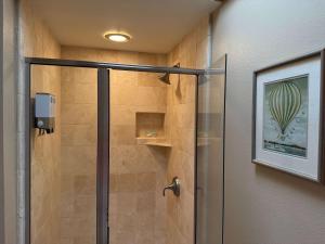 a shower with a glass door in a bathroom at A9 Direct Oceanfront 2 Level 2 Lanai Amazing Views Sunsets & AC Comfort in Lahaina +31 photos